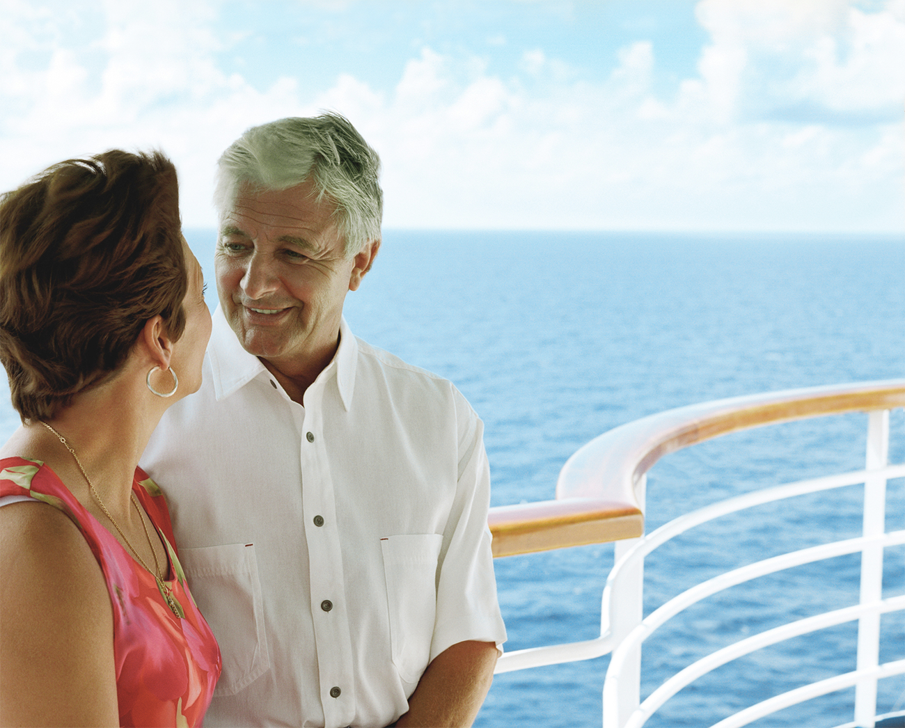 Couple standing on a cruise ship