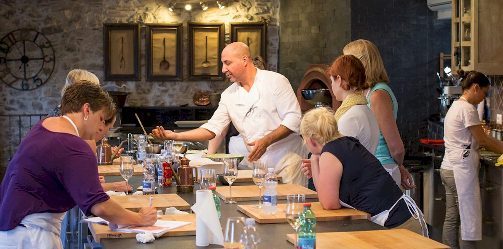 People taking a cooking class during a culinary tour