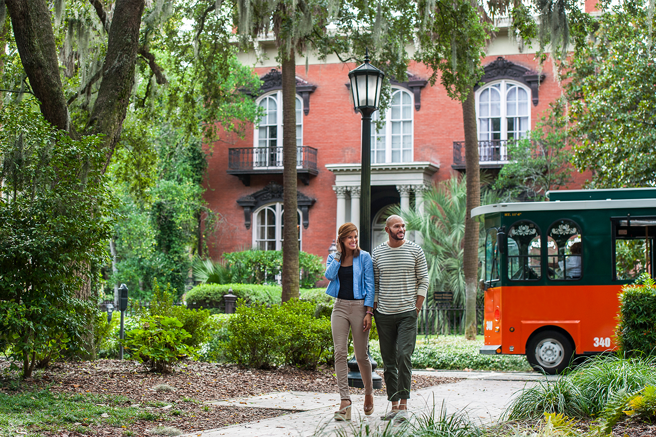 Couple walking on Monterey Square, Savannah, Georgia