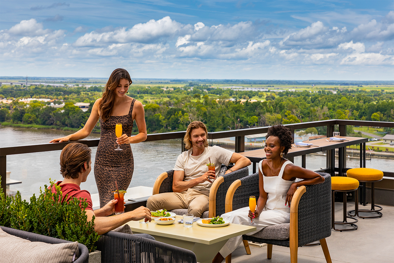 Group of people with cocktails at Bar Julian, Thompson Savannah
