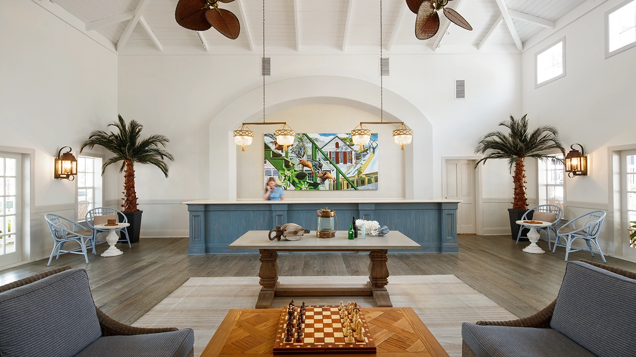 A large and welcoming lobby features the front desk, games, and seating