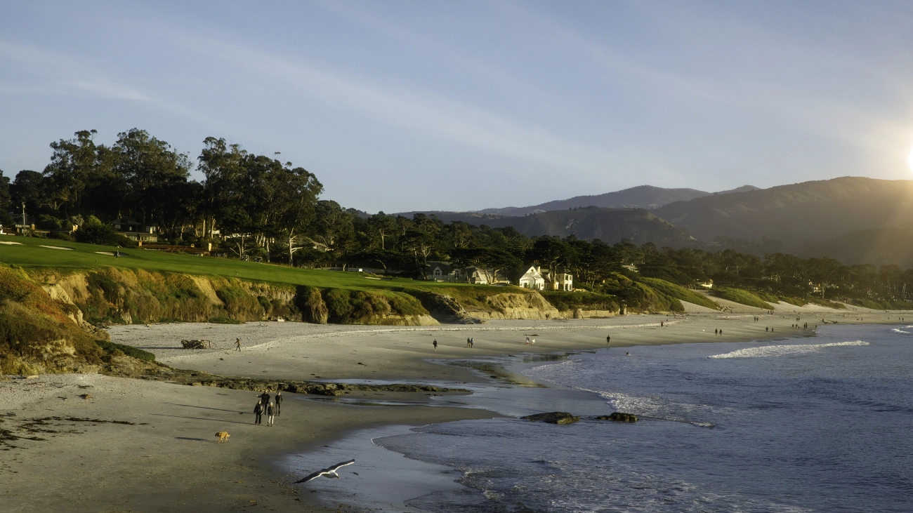 People walking on the sand at Carmel Beach