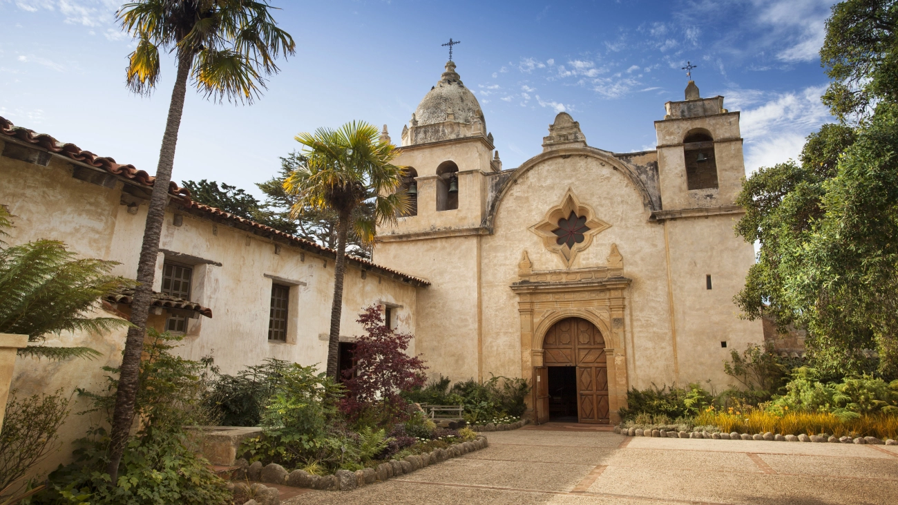 Carmel Mission Basilica with palm trees