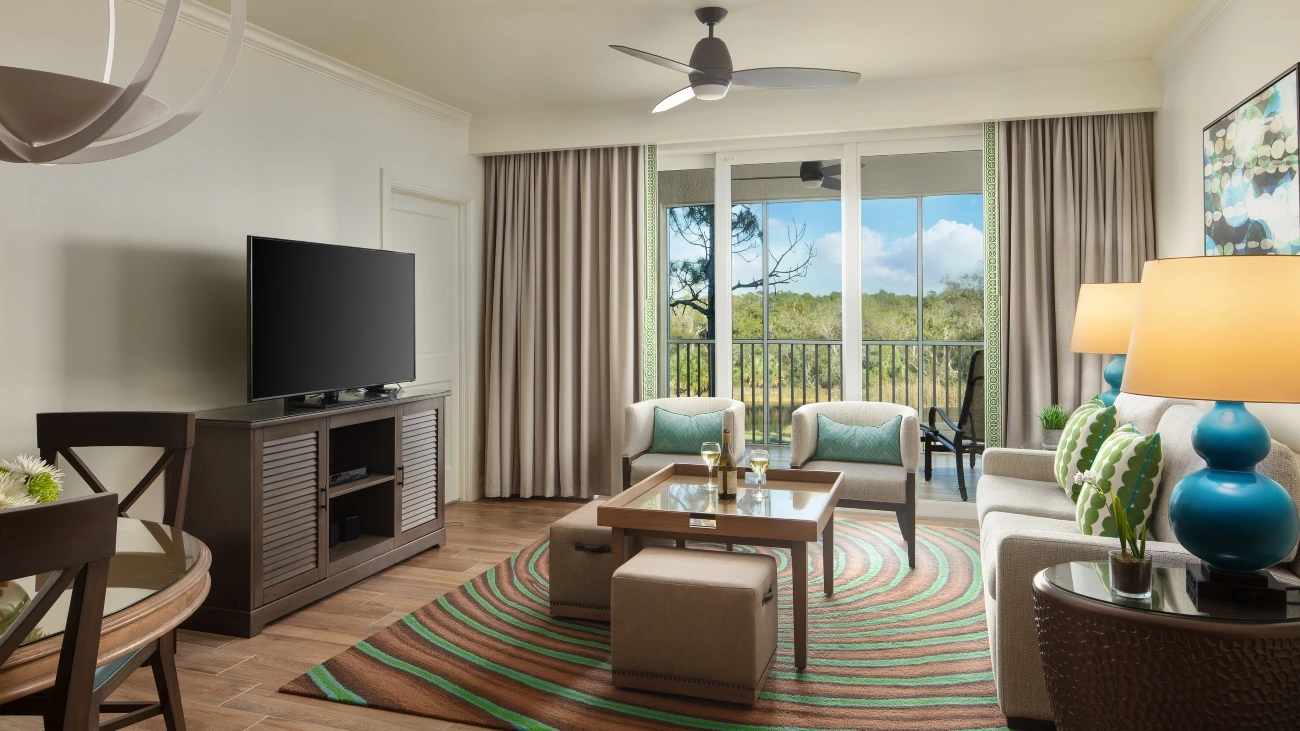 Colorful greens and natural browns make up the decorations of a resort bedroom