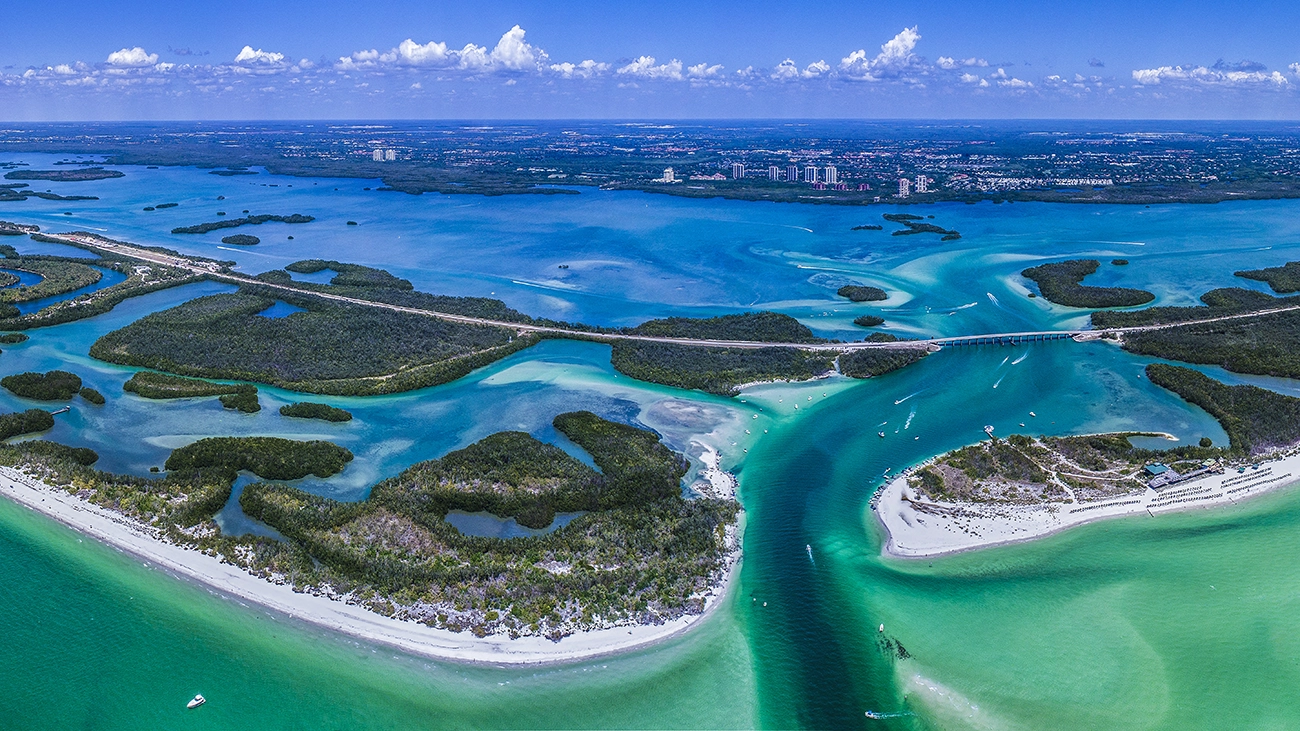Aerial view of bright blue Gulf waters and islands off the coast of Southwest Florida