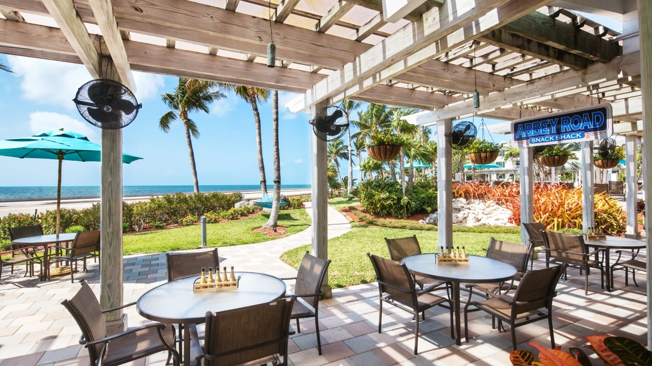Shaded outdoor patio with a view of the ocean