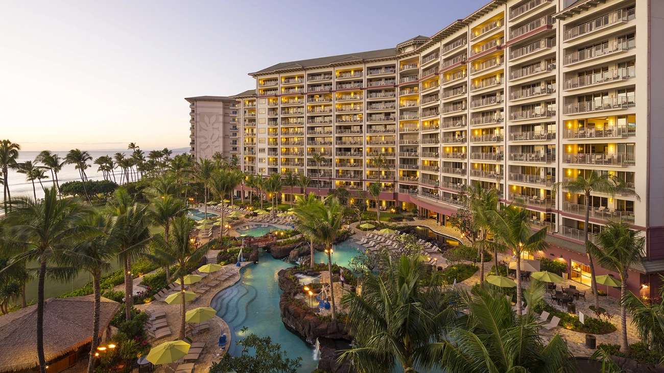 The cool orange color of the sunset hits the side of the Ka'anapali Beach resort
