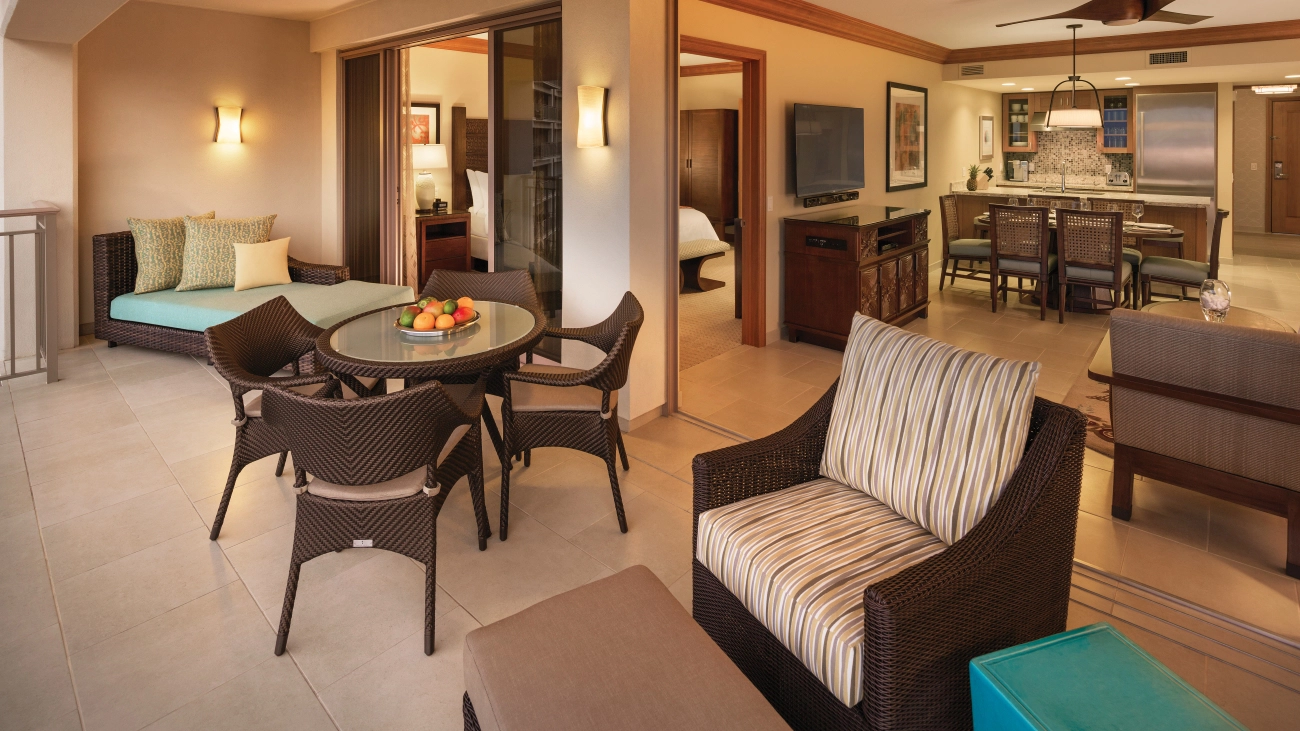 Dining room tables, chairs, and sitting areas make up the interior of the resort villa