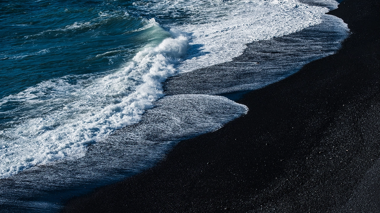 Waves crashing on Wai‘ānapanapa Black Sand Beach