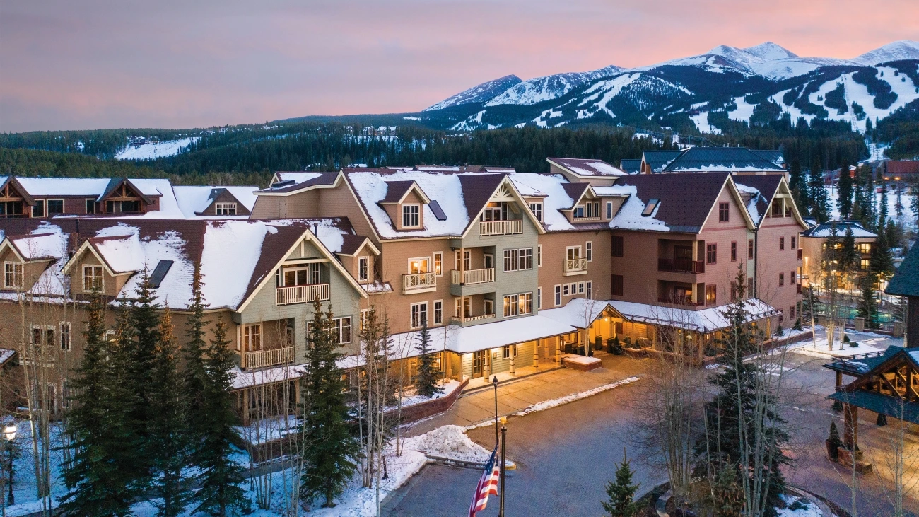 Beautiful view of mountain villas building at duck, snow-capped mountains in background
