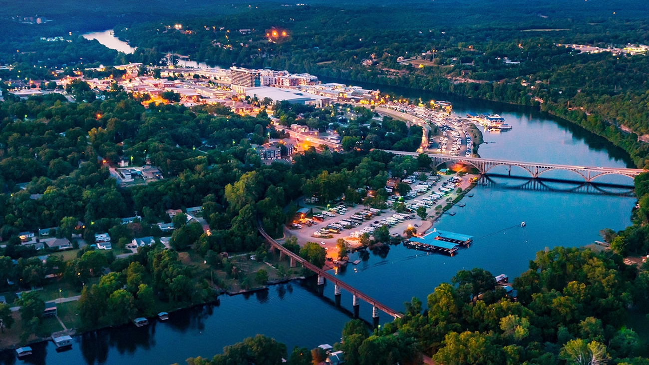 Aerial view of downtown Branson with river and bridges