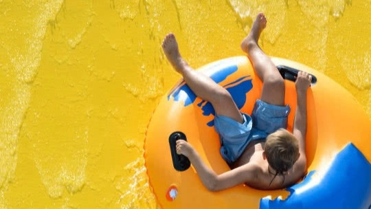 A child on a waterslide at White Water Theme Park