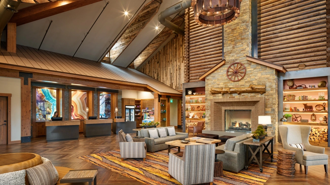 Log wall and other wood accents create a cozy ambiance in the lobby