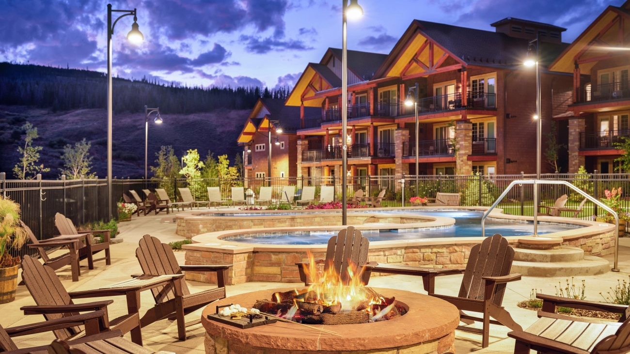 Pool deck at sunset, with fire pit and marshmallows ready to roast